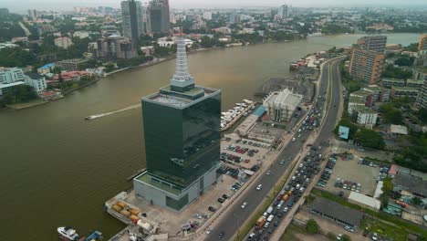 traffic and cityscape of falomo bridge, lagos law school and the civic centre tower in lagos nigeria