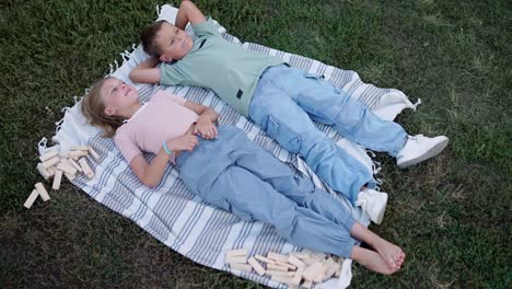 children playing on a picnic blanket