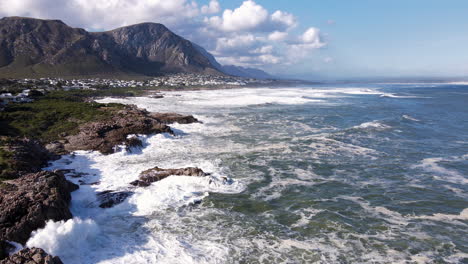 timelapse aerial hyperlapse of crashing waves agains rugged coastline, hermanus