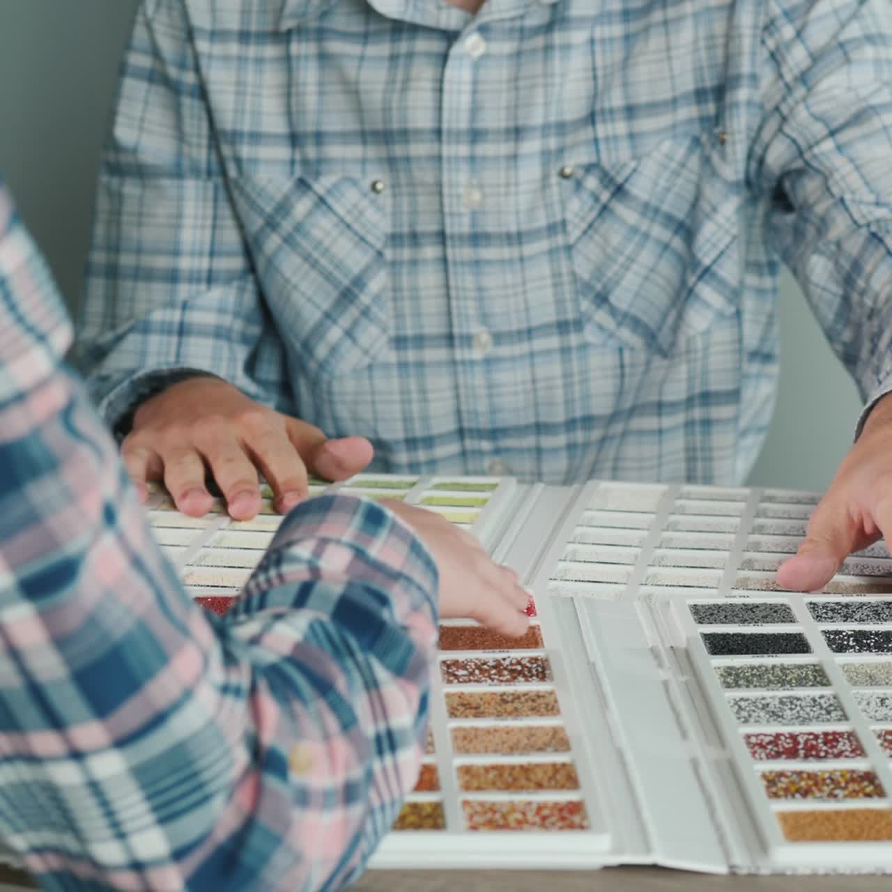 A Group Of Designers Are Working On A Color Solution Using A Catalogue Of Samples