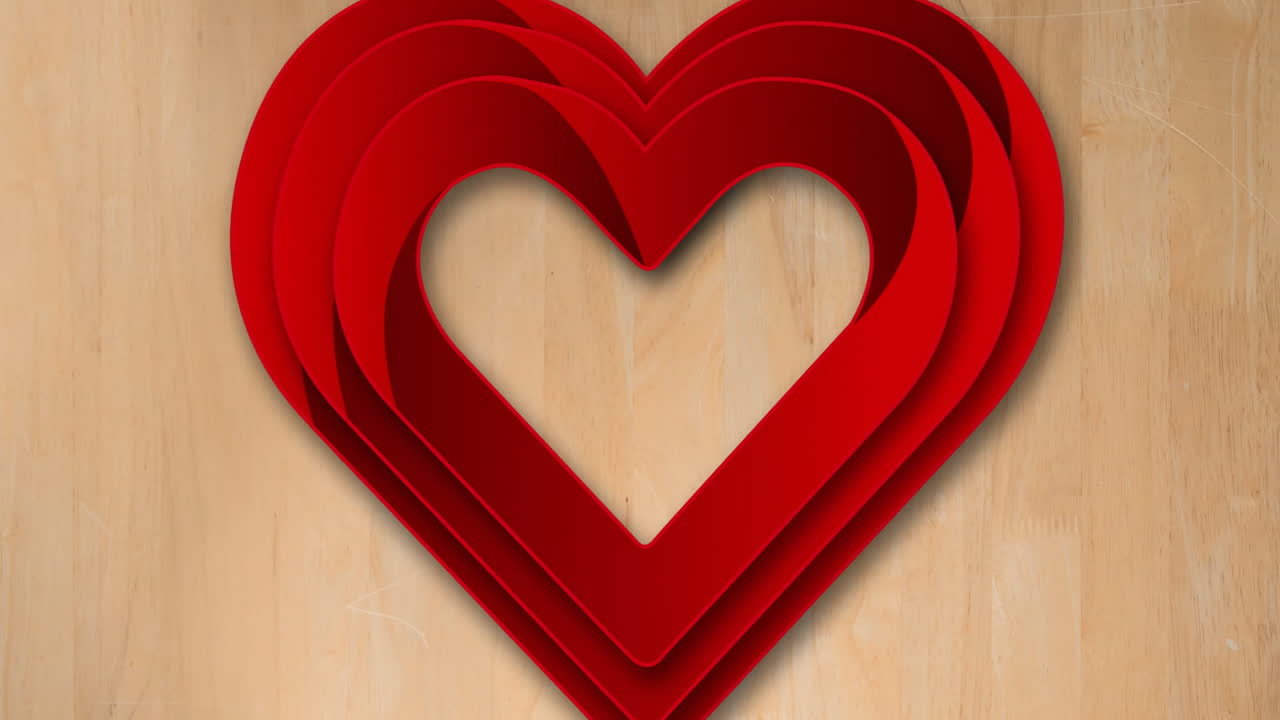 Animazione di cuori rossi sovrapposti su sfondo di legno, che simboleggia amore e romanticismo