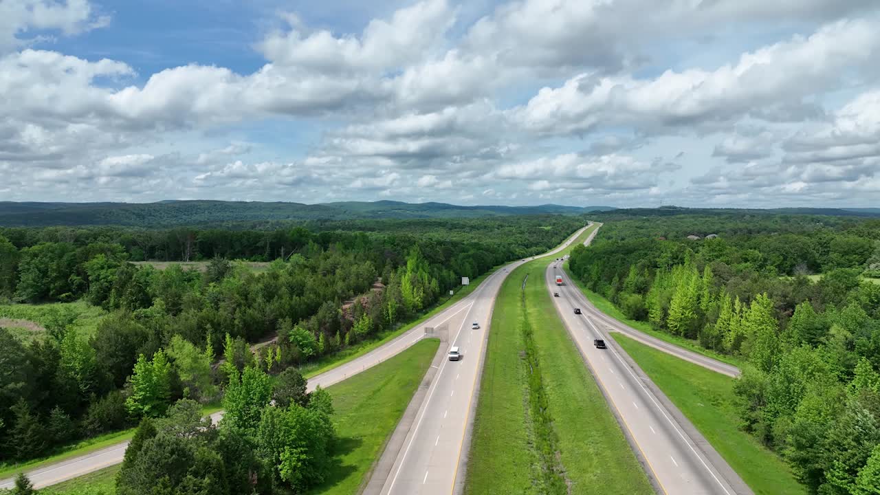 Aerial View of a Highway Through Lush Green Landscape
