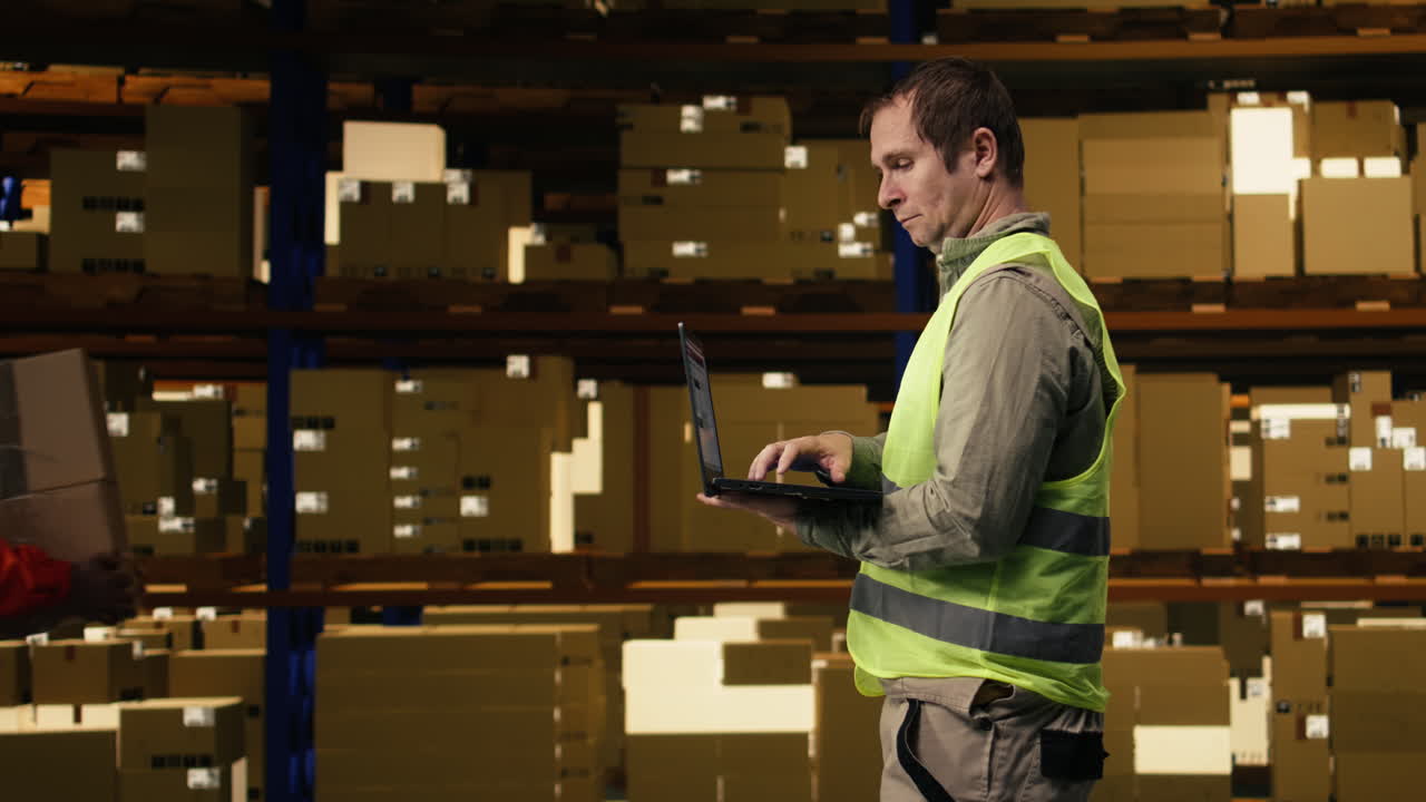 Staff preparing freight for global shipping in fulfillment center facility