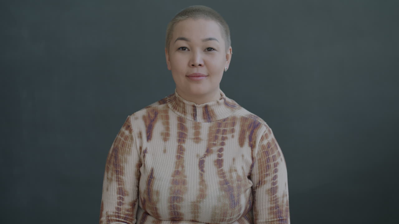 Surprised Asian Woman with Bald Head