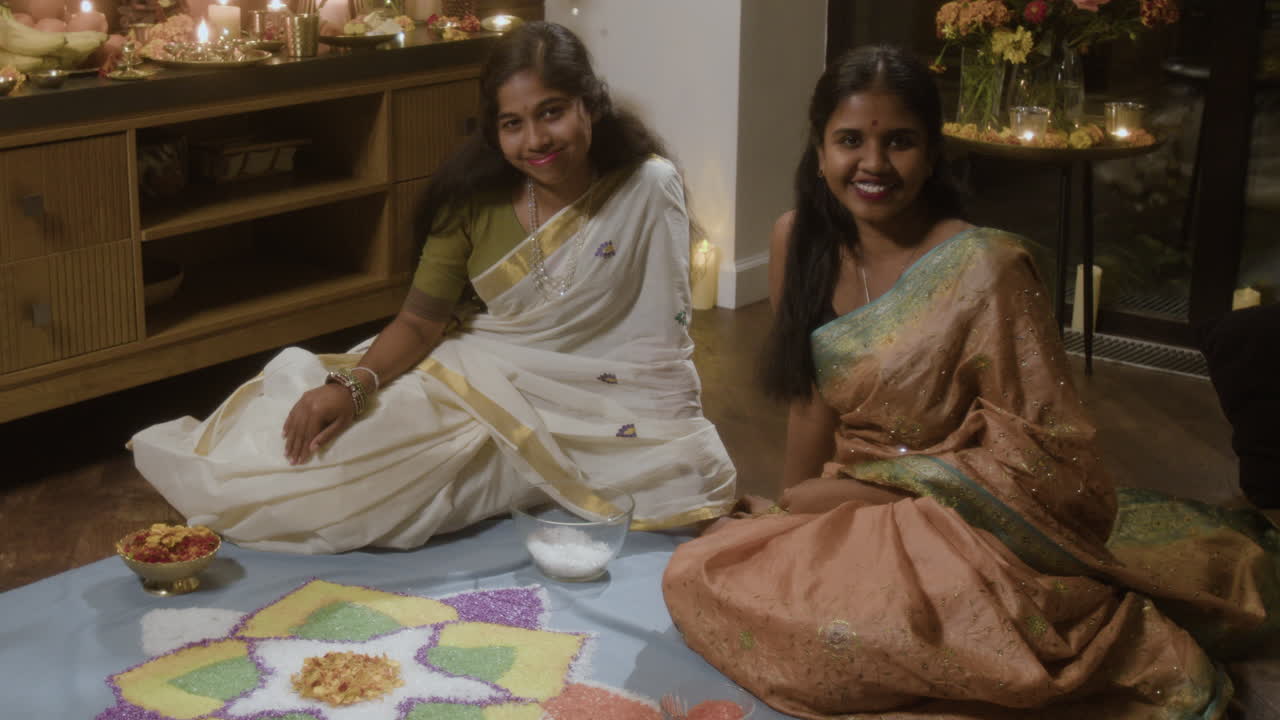 Women in Saris Making Rangoli