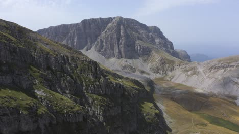 an aerial view though some high mountain peaks, in the mountain of tymfi in greece