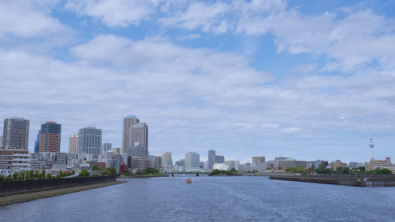 A peaceful shot of the Tokyo skyline and Sumida River with the Skytree visible on a clear day