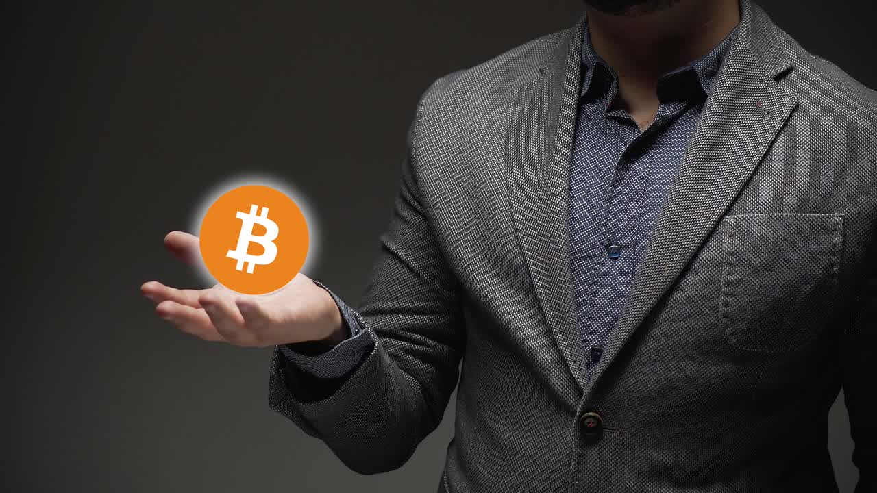 Bitcoin and cryptocurrency. a business person shows hologram of a cryptocurrency.