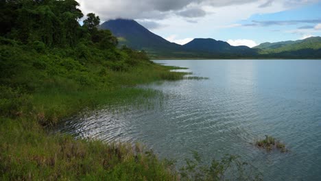 steady shot, scenic view of lake arenal in costa rica, arenal volcano in the background.