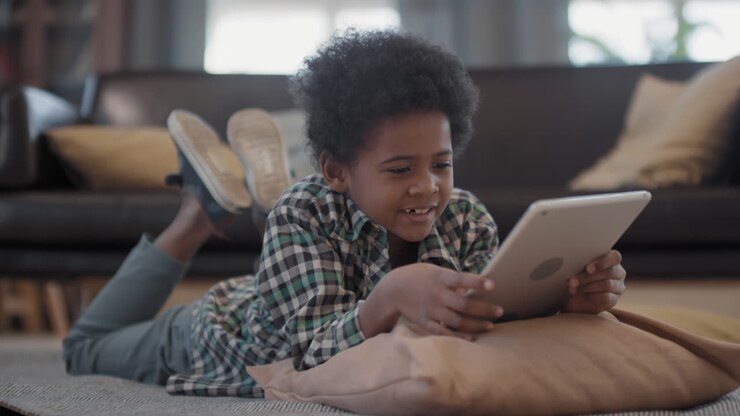 Little Afro Boy Chilling At Home With Digital Tablet