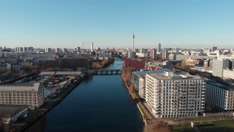 berlin wall from the river spree with a drone flying along the river and showing the berlin tv antenna made in 4k 24fps