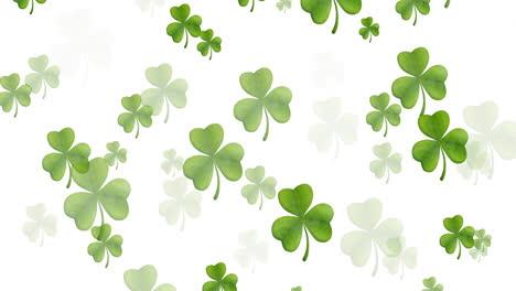 Digital-animation-of-multiple-clover-leaves-floating-against-white-background