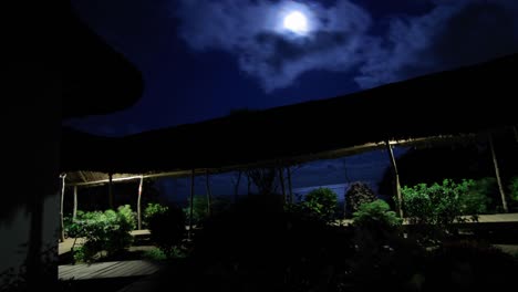 hotel at night with moon overhead
