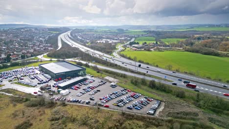 aerial drone cinematic video footage of the m1 motorway near the city of wakefield, west yorkshire, uk