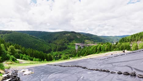 Protected-vineyards-in-a-mountain-landscape-and-bridge-in-the-background