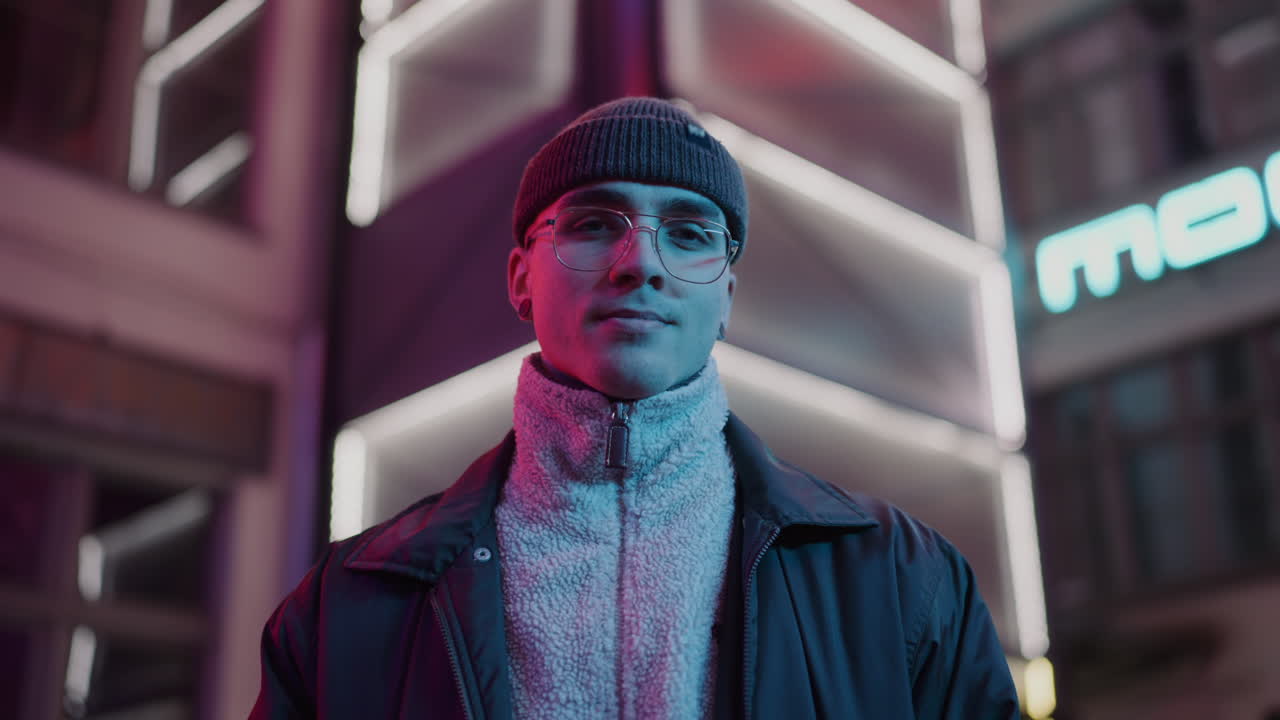 Stylish Man in Neon City Lights