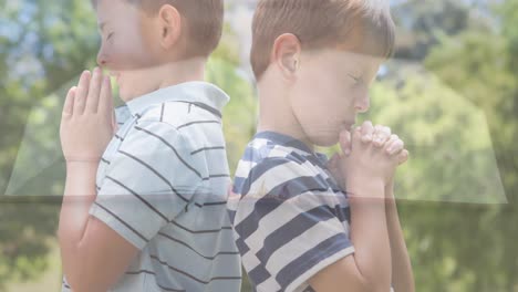 animation of caucasian boys praying and holy bible