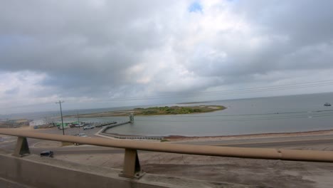 pov while for the raised bridge over laguna madre of the kennedy memorial causeway near corpus chrisi texas
