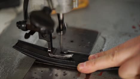 sewing leather belt on a vintage sewing machine