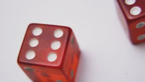 bright-red-dices-with-spots-on-sides-on-white-background