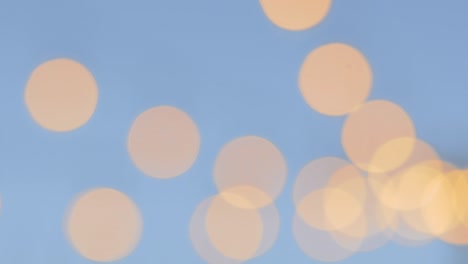 gold and blue bokeh lights over an outdoor patio