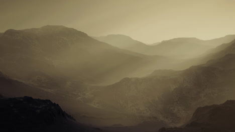serene mountain landscape enveloped in mist at dawn during early morning hours