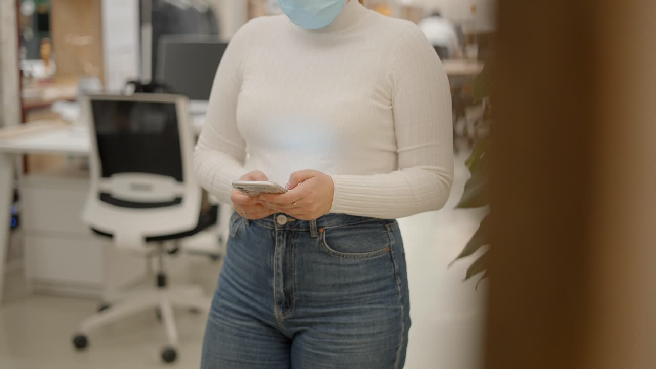 Woman Texting in Office