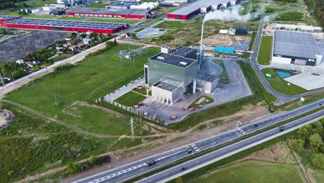 high view of an ongoing firefighter operation at a large energy facility in kaunas, showing smoke and coordinated movement