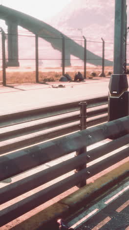 close-up of a metal fence along a highway