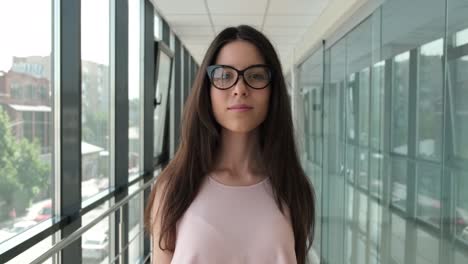 girl walks and takes off her glasses