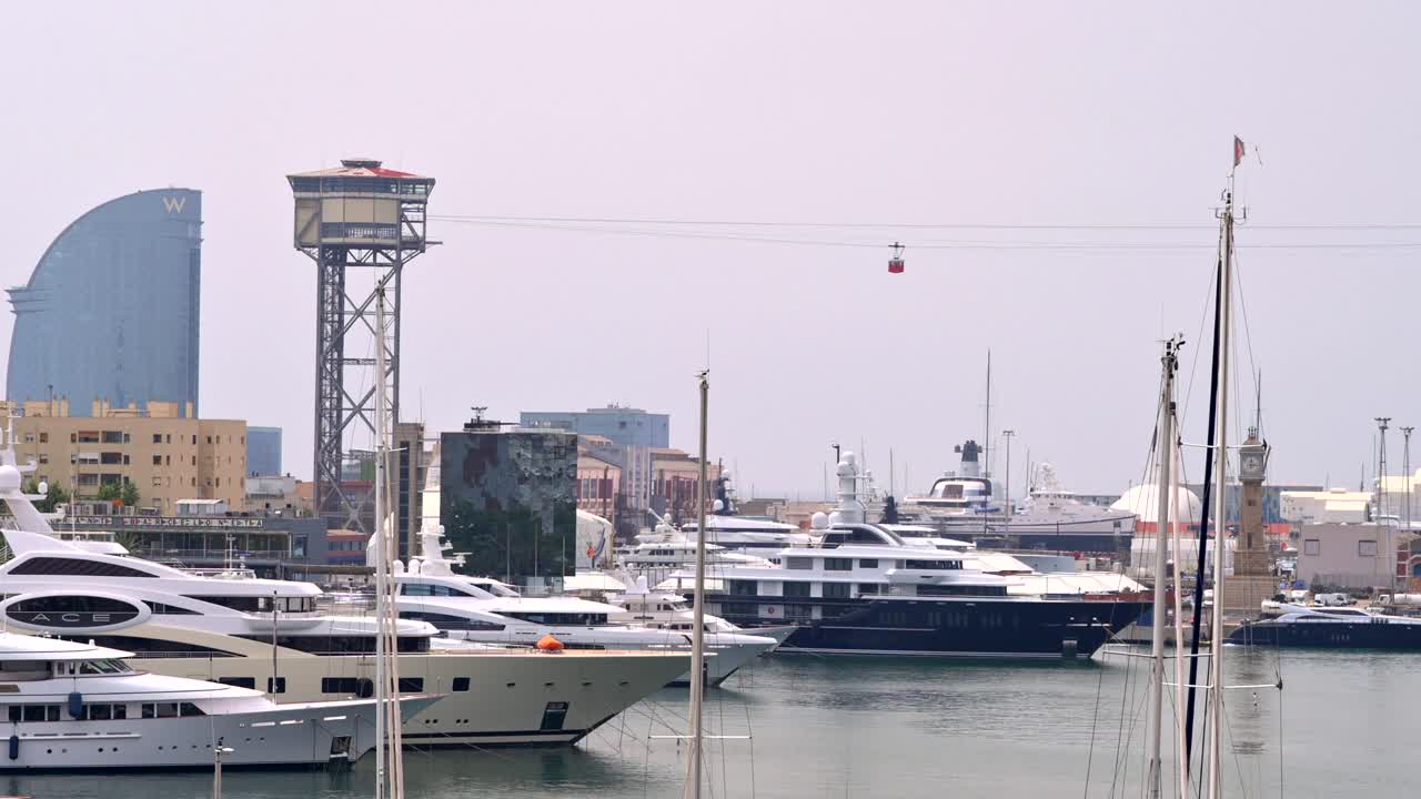 Aerial drone view of boats docked in the Port Vell in Barcelona, Spain