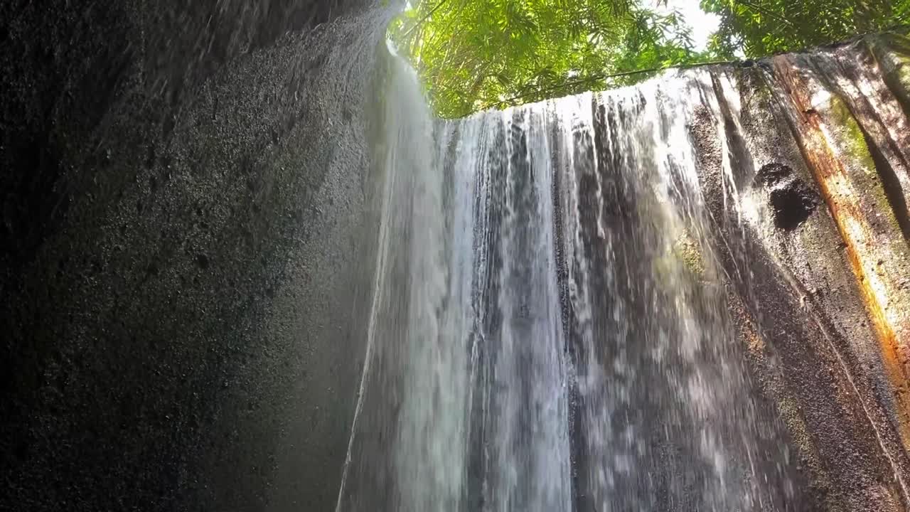 Tukad Cepung Waterfall with Panning Up View in Bali, Indonesia.