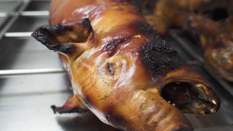 Barbecued-piglet-face-detail---B-roll---Close-up-orbit-slow-motion