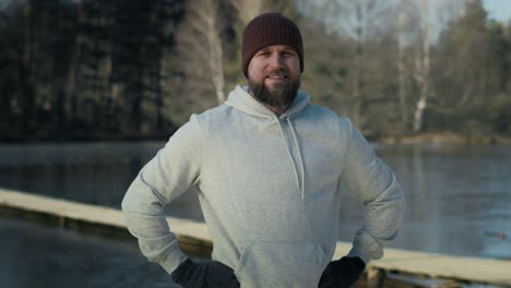 Portrait-of-caucasian-man-before-swimming-in-frozen-lake.