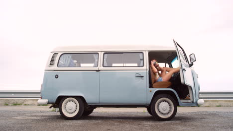 a young woman taking a break during a roadtrip to