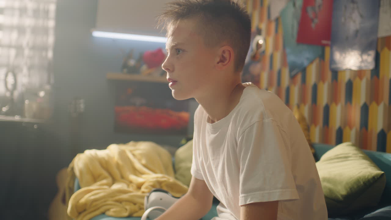 Boy Watching Game in His Bedroom