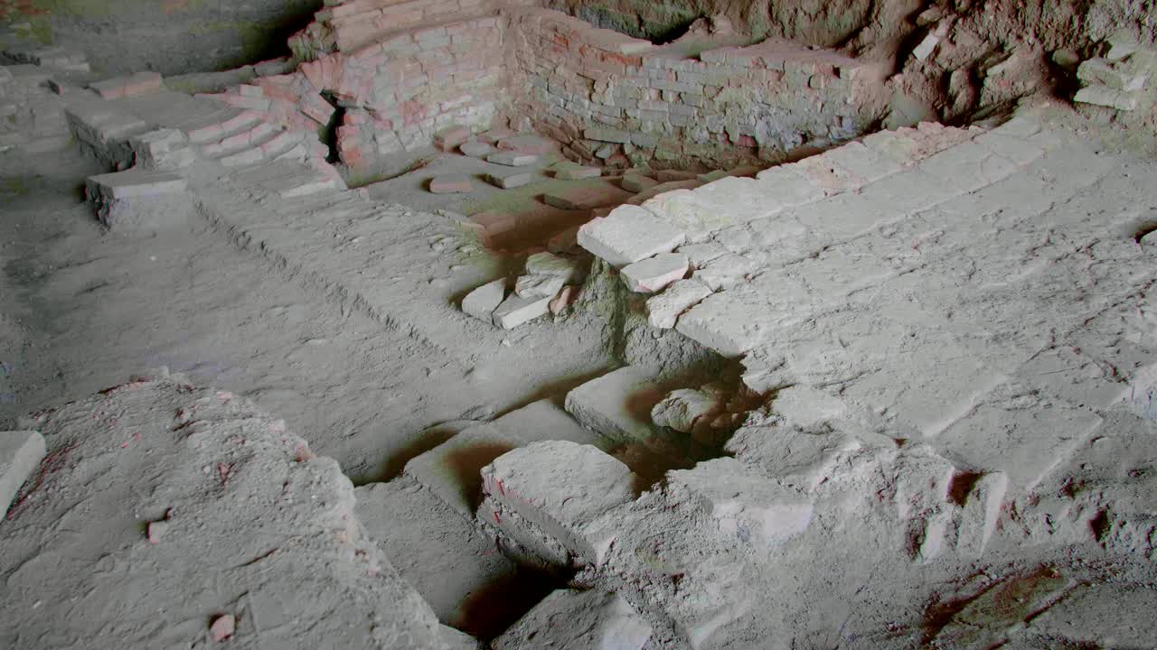 Image showing ancient brick ruins exposed at Dobrosloveni, Romania, likely the foundation or walls of a structure discovered at an archaeological site