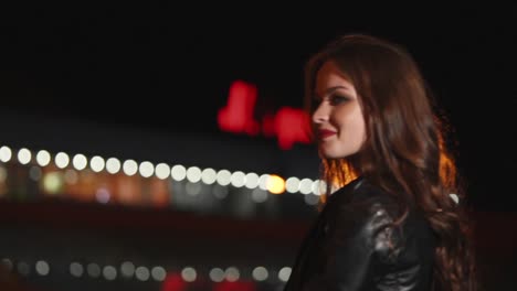woman in leather jacket at night