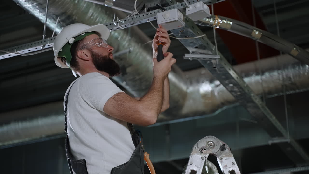 Electrician Installing Light Fixture
