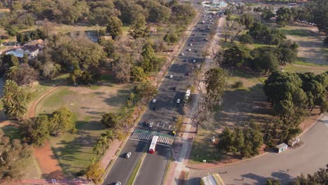 Aerial-flyover-large-avenue-with-traffic-at-Parque-Tres-de-Febrero-in-Buenos-Aires