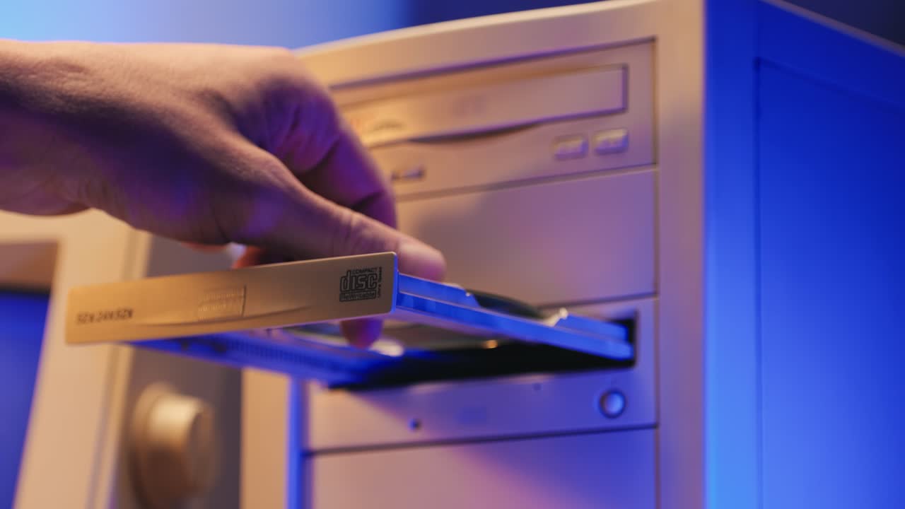 Using CD circle disk for old computer. Dvd player, disc drive. Music recorder, playing retro computer games. . High quality 4k footage