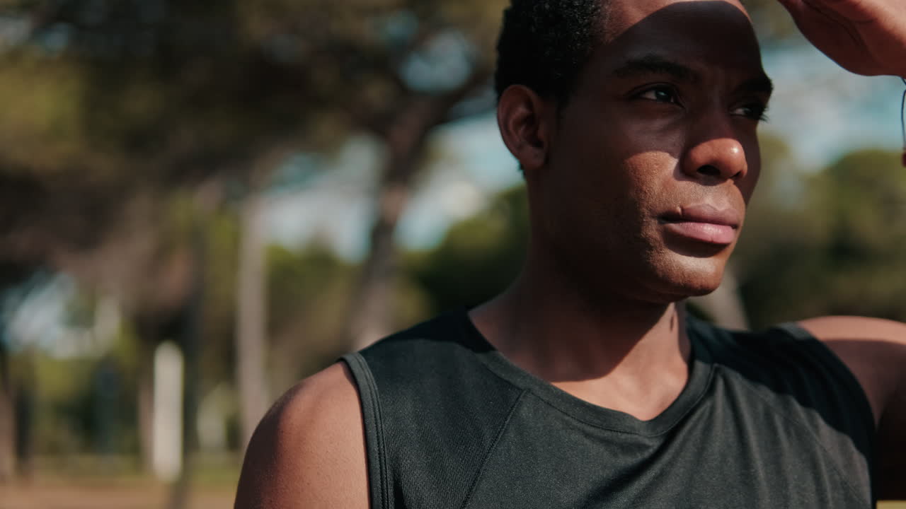 Athlete Takes a Break From His Workout