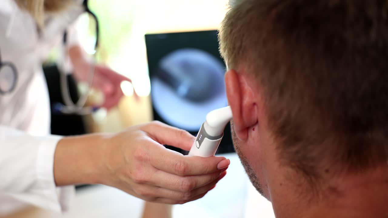 Ear examination with otoscope