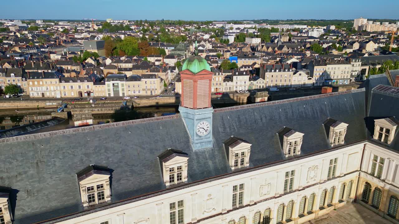 Close-up drone orbit of the iconic touristic attraction Chateau-Neuf or new Laval Castle's clock in sunny day, Laval, Mayenne, France