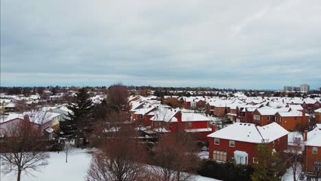 Snowcapped-roofs-in-winter,-aerial-view