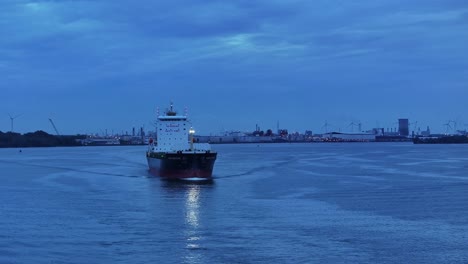 Freight-travelling-through-the-evening-waters-of-Netherlands,-aerial