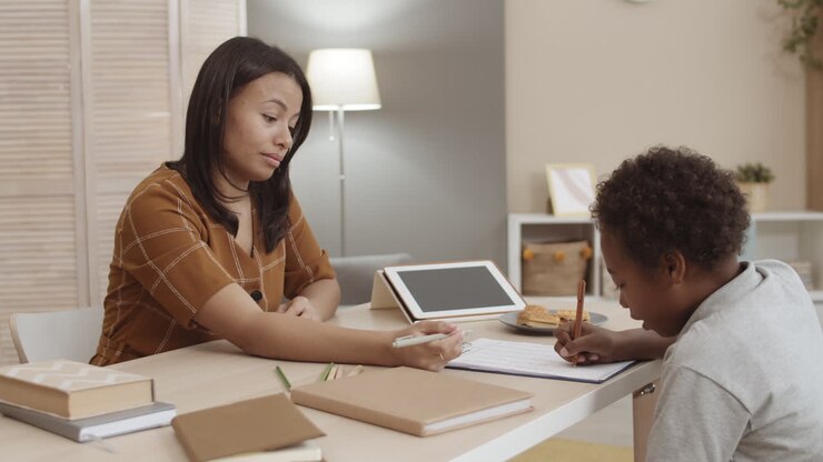 Mother helping child with homework
