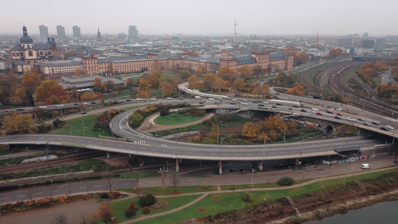 Aerial View of Mannheim Baroque Palace and Complex Highway Interchange with Traffic and Autumn Cityscape