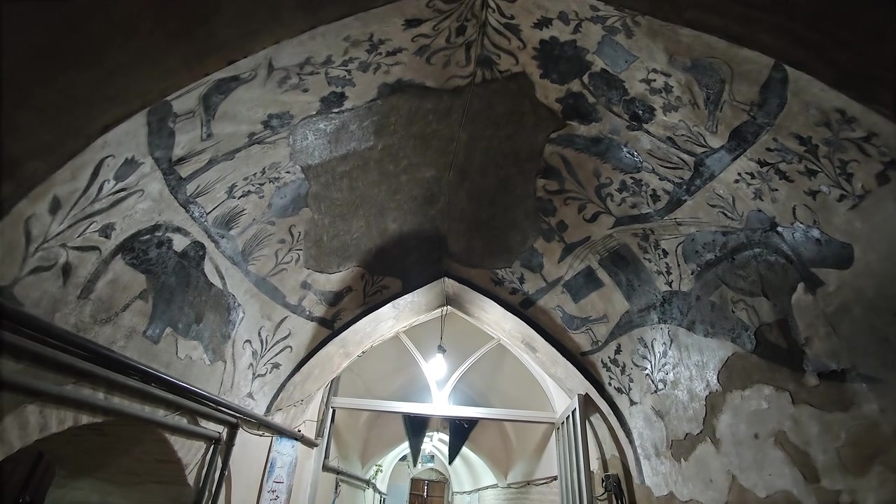 Interior of an Ancient Persian Building with Ornate Ceiling Frescoes