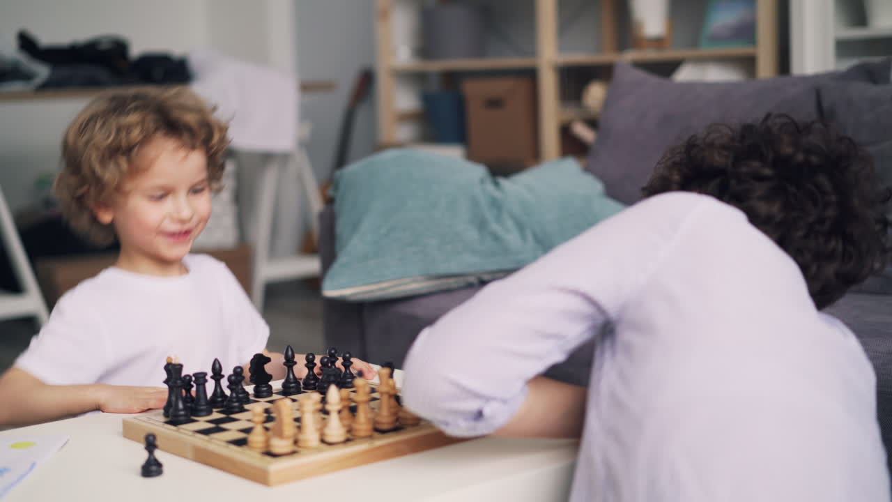 Mother and Child Playing Chess at Home